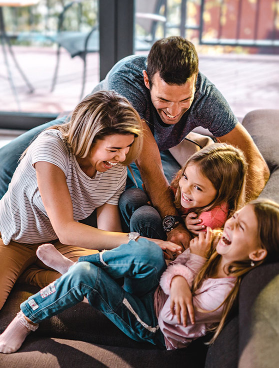 Happy Family On Sofa